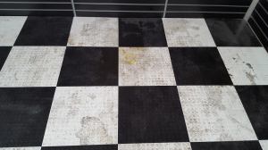 Badly stained and soiled vinyl tiles